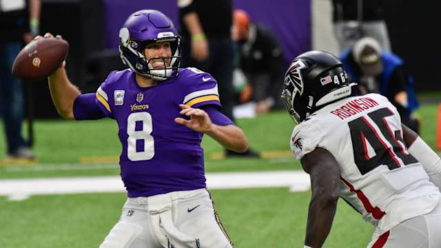 Oct 18, 2020; Minneapolis, Minnesota, USA; Minnesota Vikings quarterback Kirk Cousins (8) prepares to throw a pass as Atlanta Falcons linebacker Edmond Robinson (46) rushes during the first quarter at U.S. Bank Stadium.